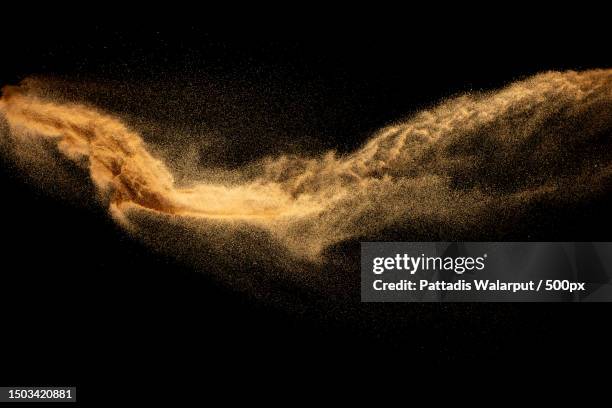 close-up of sand on sand against black background,thailand - zand stockfoto's en -beelden