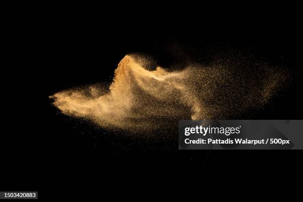 close-up of sand on sand against black background,thailand - zand stockfoto's en -beelden