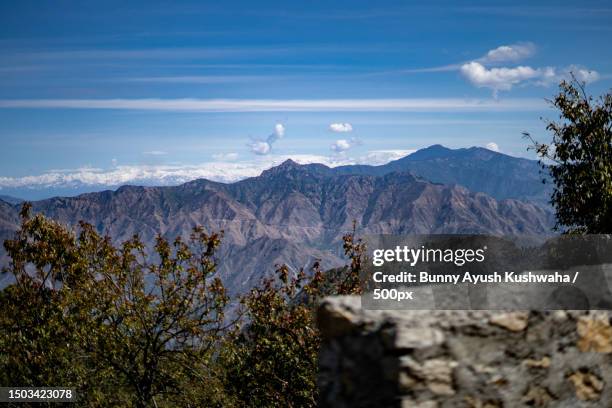 scenic view of mountains against blue sky,mussoorie,uttarakhand,india - mussoorie stock pictures, royalty-free photos & images