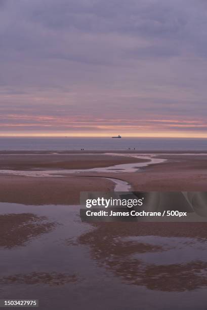 scenic view of beach against sky during sunset,blackpool,united kingdom,uk - james cochrane stock pictures, royalty-free photos & images
