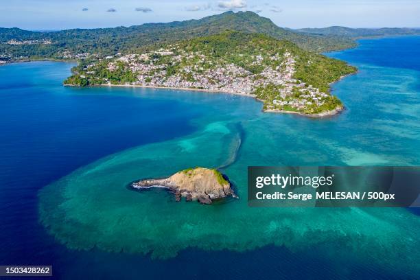 high angle view of sea and rocks against sky,mayotte - comores stock pictures, royalty-free photos & images