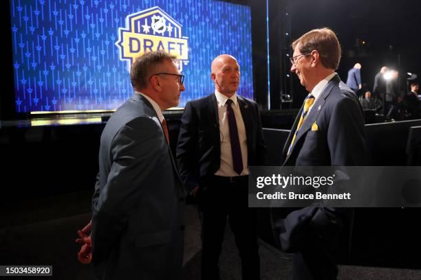 Pat Verbeek of the Anaheim Ducks, Jarmo Kekalainen of the Columbus Blue Jackets, and David Poile of the Nashville Predators talk prior to round one...