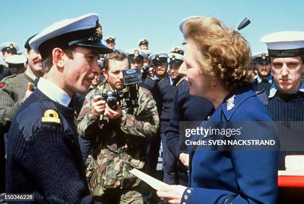 British Prime Minister Margaret Thatcher meets personnel aboard the HMS Antrim 08 January 1983 during her five-day visit to the Falkand Islands.