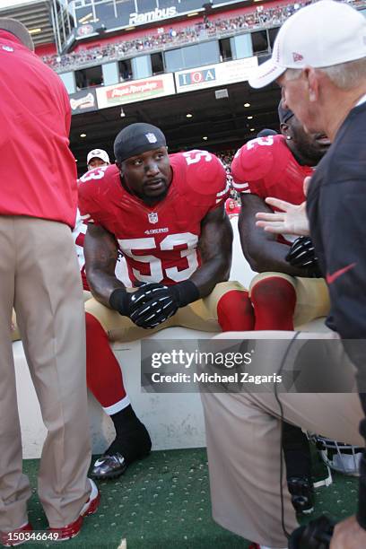 Linebackers Coach Jim Leavitt of the San Francisco 49ers talks with NaVorro Bowman on the sideline during the game against the Minnesota Vikings at...