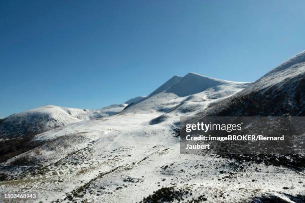 the monts dore in winter, massif of sancy, regional nature park of the volcanoes of auvergne, puy de dome department, auvergne, france - bernard jaubert stock illustrations