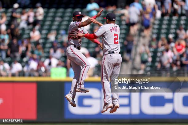 Derek Hill and Luis Garcia of the Washington Nationals celebrate their 4-1 win against the Seattle Mariners at T-Mobile Park on June 28, 2023 in...