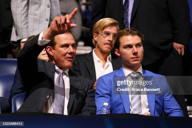 Tom Bedard and Connor Bedard look on prior to round one of the 2023 Upper Deck NHL Draft at Bridgestone Arena on June 28, 2023 in Nashville,...