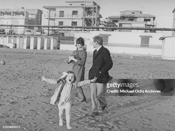 Actors Klaus Kinski and Ruth Brigitte Tocki with their daughter Nastassja Kinski pose for a portrait in a park in March 1966 in Rome, Italy.
