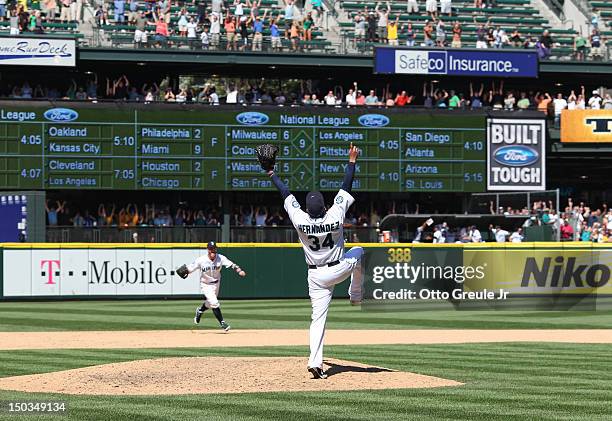 Starting pitcher Felix Hernandez of the Seattle Mariners and shortstop Brendan Ryan celebrate after Hernandez threw the 23rd perfect game in Major...