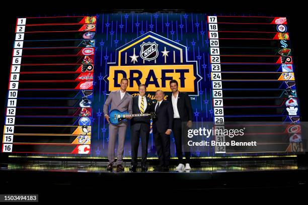 Pekka Rinne, David Poile of the Nashville Predators, NHL commissioner Gary Bettman and Roman Josi pose for a photo on stage during round one of the...