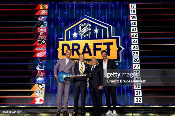 Pekka Rinne, David Poile of the Nashville Predators, NHL commissioner Gary Bettman and Roman Josi pose for a photo on stage during round one of the...