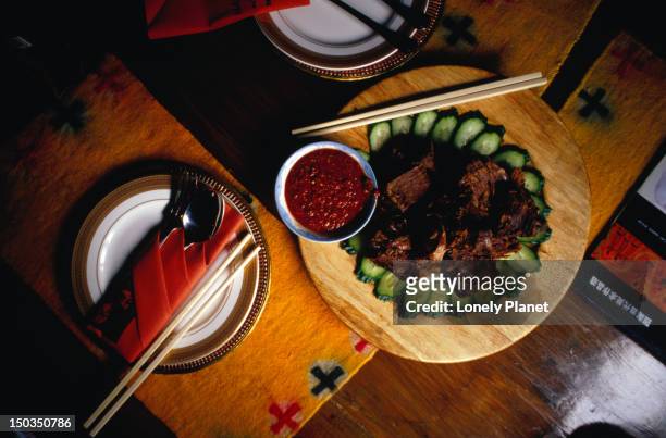 yak meat with beer from the makye ame restaurant near the jianguomenwai embassy area in beijing. - jianguomenwai stock pictures, royalty-free photos & images