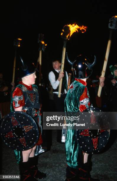 young vikings taking part in the torch light procession to calton hill, hogomanay. - lpiowned stock pictures, royalty-free photos & images