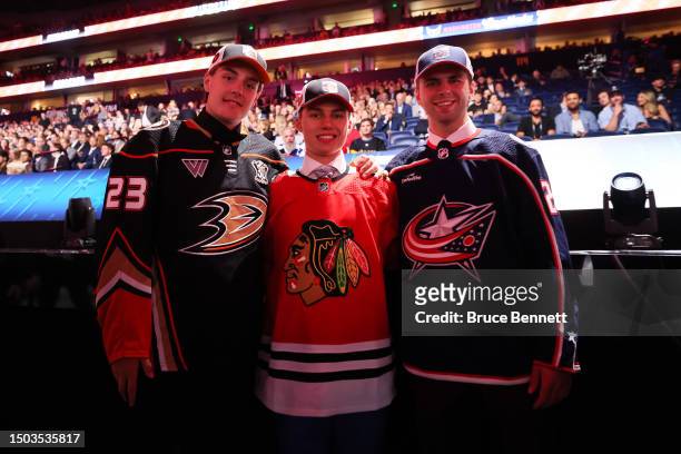 Leo Carlsson of the Anaheim Ducks, Connor Bedard of the Chicago Blackhawks and Adam Fantilli of the Columbus Blue Jackets pose for a photo after...