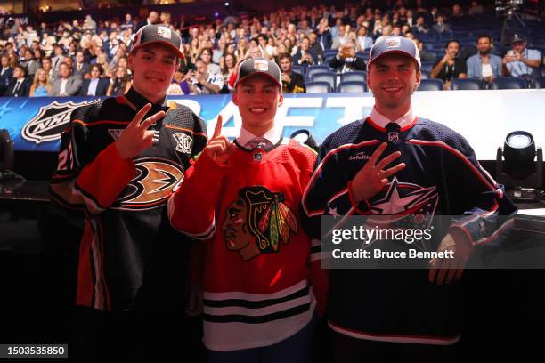 Leo Carlsson of the Anaheim Ducks, Connor Bedard of the Chicago Blackhawks and Adam Fantilli of the Columbus Blue Jackets pose for a photo after...