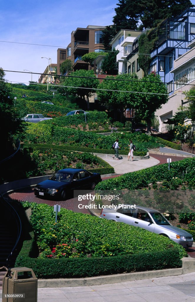 Traffic makes its way down famous Lombard Street.