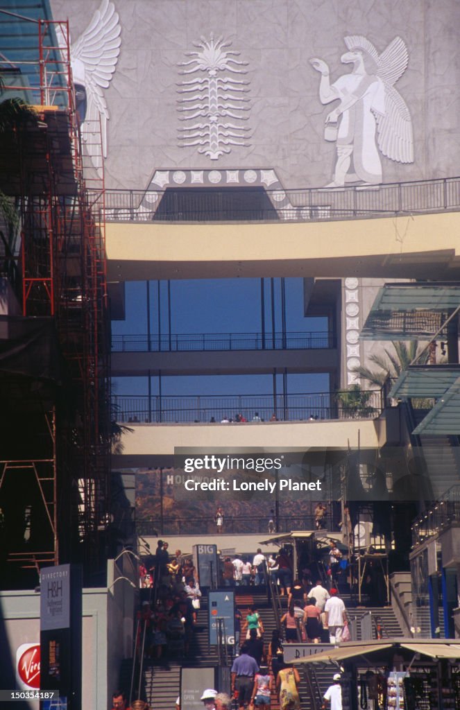 Courtyard of Kodak Theater with Hollywood sign in distance.