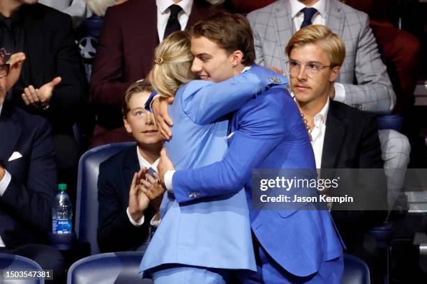 Connor Bedard celebrates with family after being selected with the first overall pick by the Chicago Blackhawks during round one of the 2023 Upper...