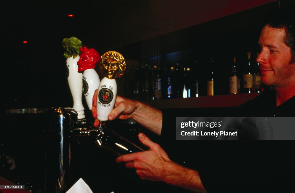 Bartender in Feenie's Restaurant, Kitsilano neighbourhood.