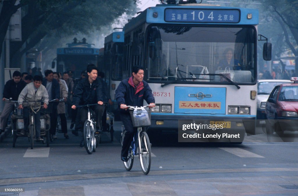 Buses, bicycles and car traffic in Dongcheng, Beijing.