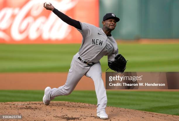 Domingo German of the New York Yankees pitches against the Oakland Athletics in the bottom of the first inning at RingCentral Coliseum on June 28,...