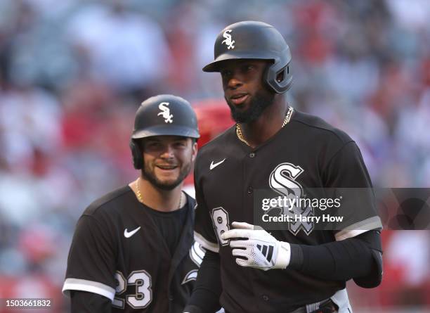 Luis Robert Jr. #88 of the Chicago White Sox celebrates a two run homerun with Andrew Benintendi, to take a 2-0 lead over the Los Angeles Angels,...