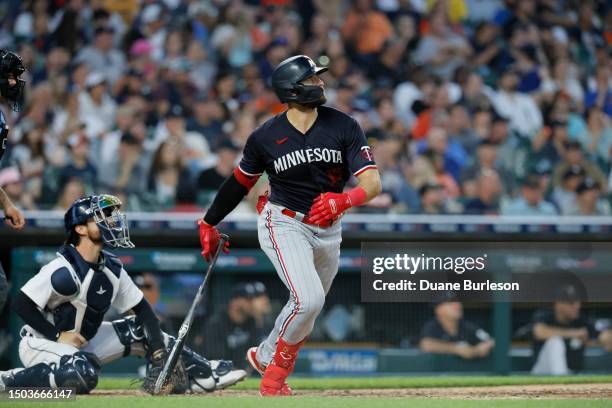 Joey Gallo of the Minnesota Twins watches his solo home run in the seventh inning with catcher Eric Haase of the Detroit Tigers behind the plate at...