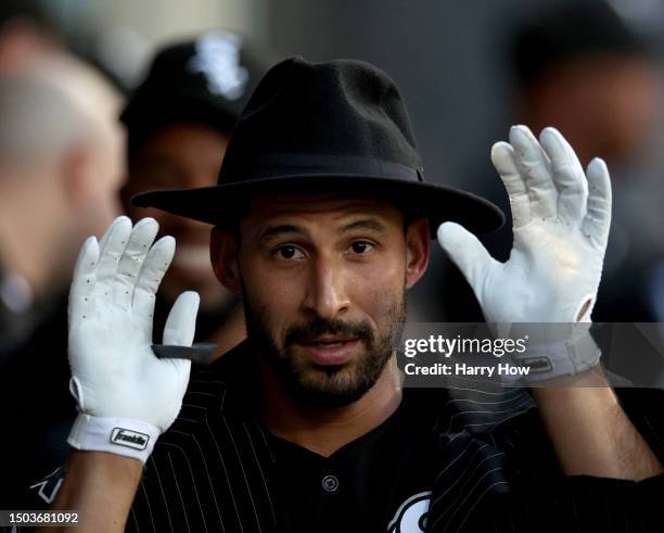 Seby Zavala of the Chicago White Sox celebrates his second homerun of the game in the dugout by wearing a costume, to take a 9-2 lead over the Los...