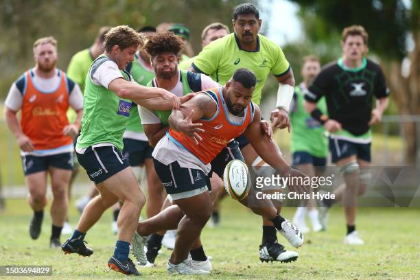 Taniela Tupou is tackled during the Australian Wallabies training session at Sanctuary Cove on June 29, 2023 in Gold Coast, Australia.