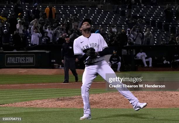 Domingo German of the New York Yankees celebrates his no-hit perfect game against the Oakland Athletics, defeating them 11-0 at RingCentral Coliseum...