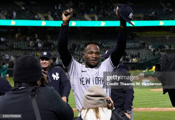 Domingo German of the New York Yankees celebrates his no-hit perfect game against the Oakland Athletics, defeating them 11-0 at RingCentral Coliseum...