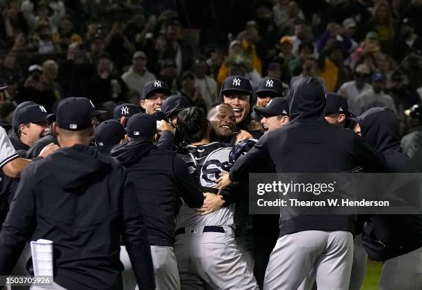 Domingo German of the New York Yankees celebrates his no-hit perfect game against the Oakland Athletics, defeating them 11-0 at RingCentral Coliseum...