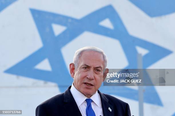 Israel's Prime Minister Benjamin Netanyahu delivers a speech during his visit to an Israeli unmanned aerial vehicle centre, at the Palmachim Airbase...