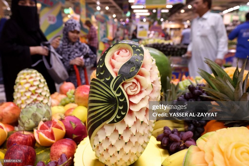 Carved fruits adorn a store in Kuwait City on July 5, 2023. News Photo ...