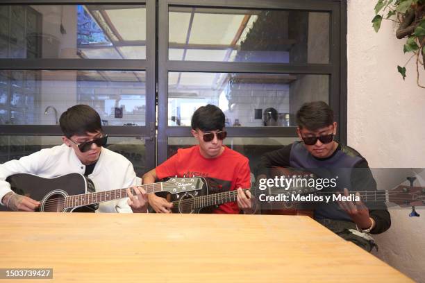 Emanuel Silva, David Farias and Fernando Acosta of Alto Linaje Band perform during a press conference at Casa Amatlan on June 28, 2023 in Mexico...