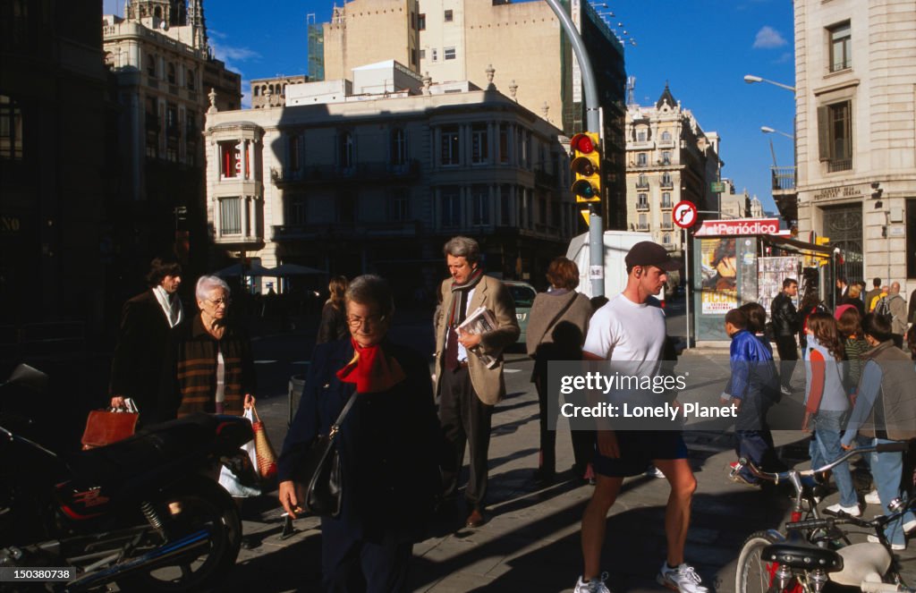 People carrying out daily business, corner of C/Argentaria.