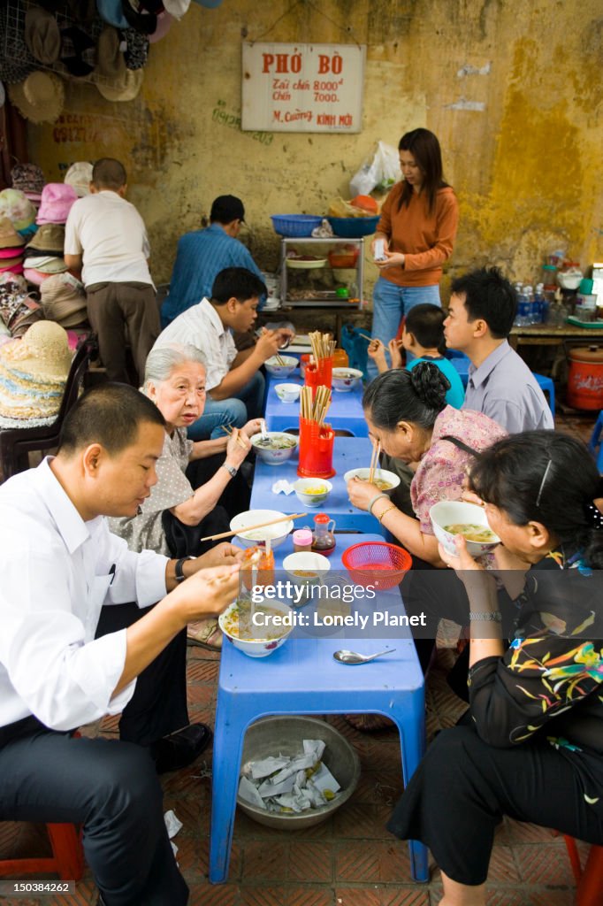 People dining at street food stall, Old Quarter.
