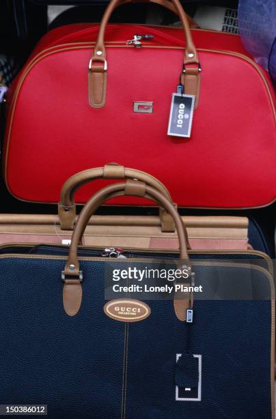 fake reproduction luggage for sale in the xiushui silk market in the jianguomenwai embassy area in beijing. - jianguomenwai stock pictures, royalty-free photos & images