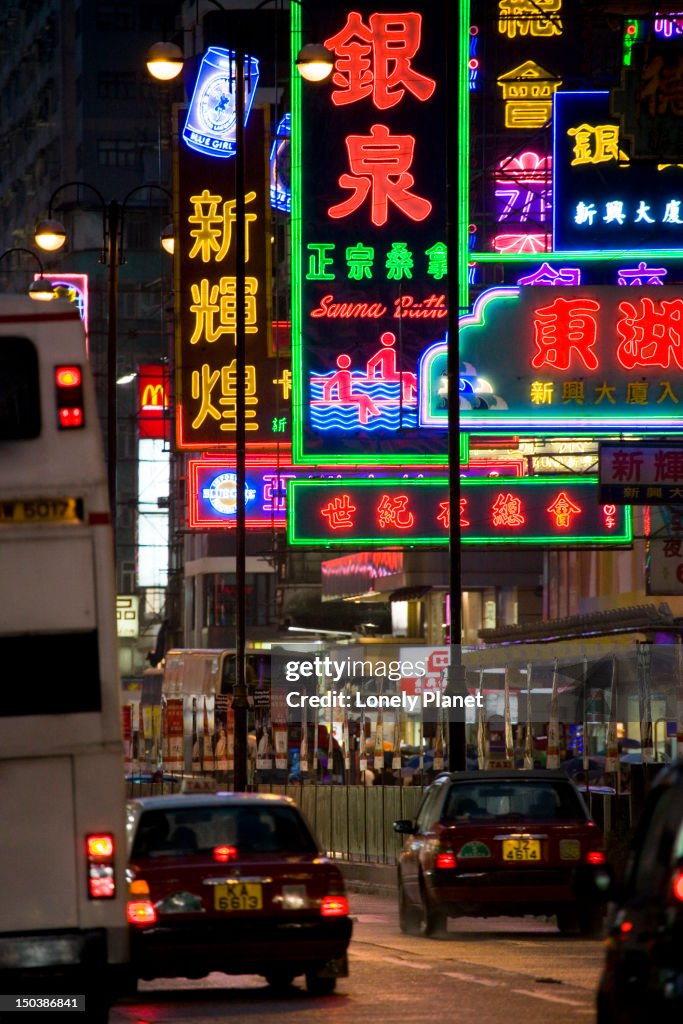 Buses and neon signs on Nathan Road, Mong Kok.