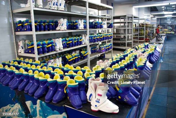 ski boots at shanghai yinqixing indoor skiing resort. - lonely planet collection stock pictures, royalty-free photos & images