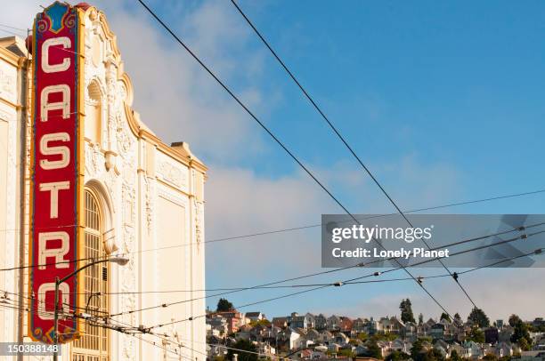 castro theater, overhead wires and houses. - castro district stock pictures, royalty-free photos & images