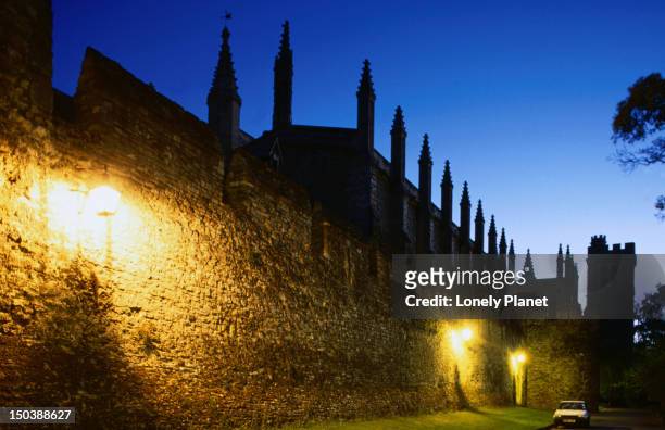 the medieval walls and chapel tower of new college - lpiowned stock pictures, royalty-free photos & images