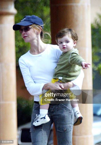 Calista Flockhart returns to her car with her son Liam 3after shopping at Longs Drugs store October 18, 2002 in Brentwood, California.