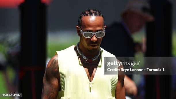 Lewis Hamilton of Great Britain and Mercedes walks in the Paddock during previews ahead of the F1 Grand Prix of Austria at Red Bull Ring on June 29,...