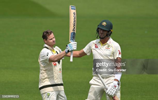 Australia batsman Steve Smith celebrates his century with captain Pat Cummins during Day Two of the LV= Insurance Ashes 2nd Test match between...