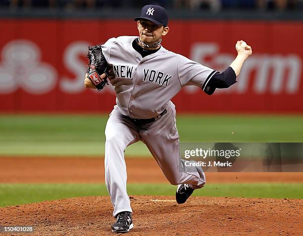 Pitcher Clay Rapada of the New York Yankees pitches against the Tampa Bay Rays during the game at Tropicana Field on July 2, 2012 in St. Petersburg,...