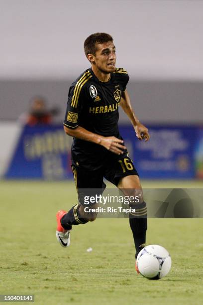 Hector Jimenez of Los Angeles Galaxy dribbles the ball during the MLS match against Chivas USA at The Home Depot Center on August 12, 2012 in Carson,...