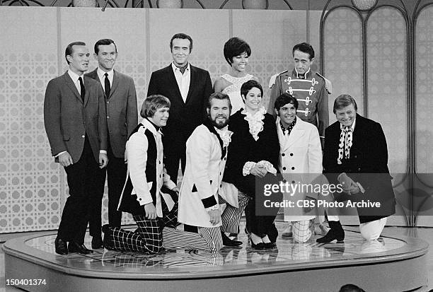 The Smothers Brothers Comedy Hour. Standing from left: Tom Smothers, Dick Smothers, Ricardo Montalban, Diahann Carroll, Pat Paulsen. Kneeling from...