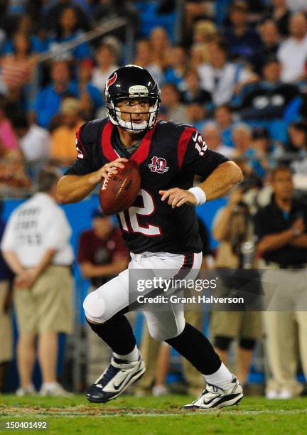 John Beck of the Houston Texans rolls out against the Carolina Panthers during a preseason game at Bank of America Stadium on August 11, 2012 in...