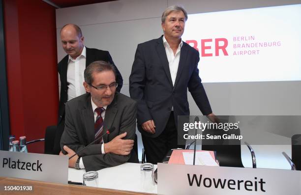 Berlin mayor Klaus Wowereit , Brandenburg Governor Matthias Platzeck and Transport Ministry State Secretary Rainer Bomba arrive to give a press...